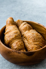 Freshly Baked Croissants in Wooden Bowl. Bakery Concept.