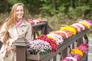  portrait of young woman in autumn park. Autumn or spring travel woman