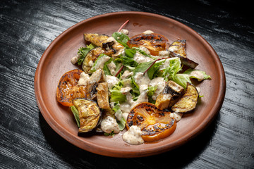 Grilled vegetable salad. Salad of barbecued zucchini, eggplant, onion.