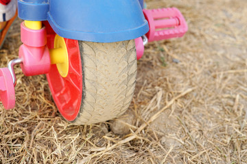 Colorful wide small wheel from children tricycle