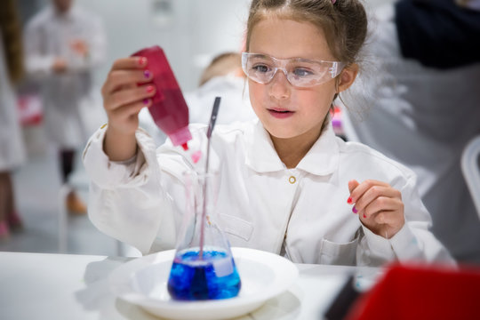 Helsinki, Finland: Finnish science center Heureka in Vantaa. Children's chemical laboratory in the scientific-interactive Museum. A little girl is passionate about chemical experiments