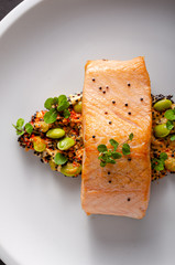 Grilled salmon with pepper hummus with quinoa