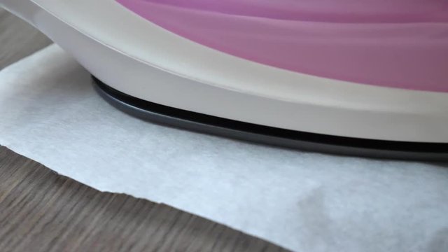 Ironing on fusable craft beads in a clever design