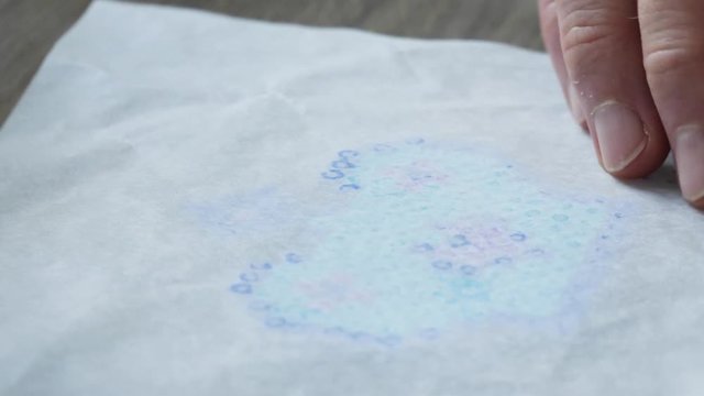 Ironing fuse beads in a cute pattern made by a child