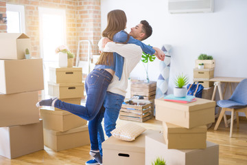 Fototapeta na wymiar Beautiful young asian couple hugging in love, smiling happy and very excited for moving to a new home