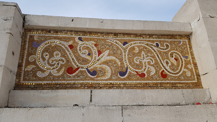 Part of a mosaic ornament with gold parts near the Orthodox monastery.