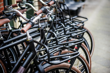 Fototapeta na wymiar Bicycle parking in row. Denmark new modern city bikes for sell.