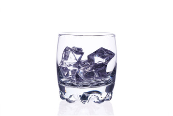 A glass of whiskey with ice cubes on a white background.