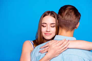Close-up portrait of her she his he two nice attractive charming lovely sweet gentle cheerful life partners hugging isolated over bright vivid shine vibrant blue turquoise color background