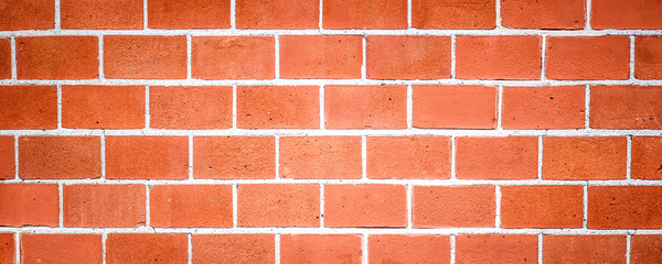 Red brick wall panorama or background.  Old vintage texture surface of masonry.