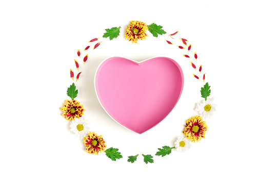 pattern of gift box shape of heart, flowers yellow, red, white asters, green leaves isolated on white background Flat lay Top view Mock up Sesonal concept Hello autumn, spring or summer Holiday card - Powered by Adobe
