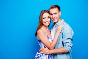 Portrait of his he her she two nice attractive charming sweet affectionate cheerful cheery family embracing isolated over bright vivid shine vibrant blue turquoise color background