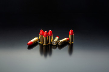 Bullet isolated on black background with reflexion. Rifle bullets close-up on black back. Cartridges for rifle and carbine on a black.