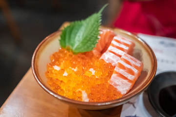 Close up of salmon don on the table, fresh sashimi, raw salmon, salmon roe.