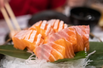 Close up of Salmon sashimi on the bowl.