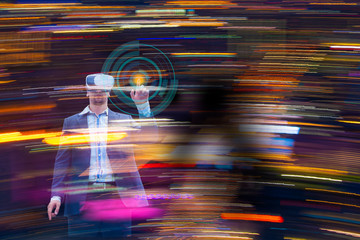Double exposure businessman wearing Virtual Reality to touch objects in virtual using light colorful in abstract digital.