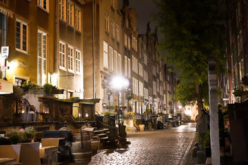 Fototapeta na wymiar Gdansk, Poland - September 2019: View of the night streets of the city. The architecture of the old city in the night.