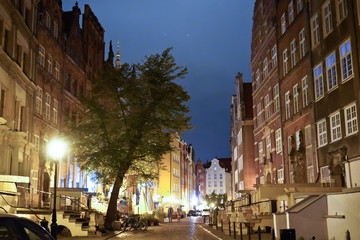 Fototapeta na wymiar Gdansk, Poland - September 2019: View of the night streets of the city. The architecture of the old city in the night.