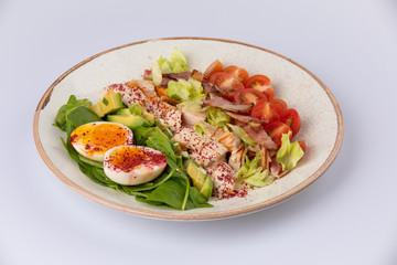 Healthy Hearty Cobb Salad with Chicken, Bacon, Tomato, avocado and Eggs
