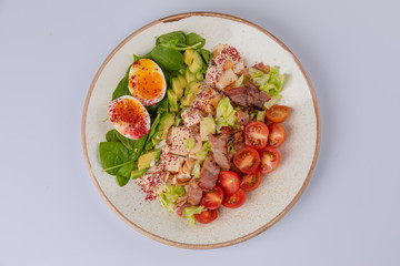 Healthy Hearty Cobb Salad with Chicken, Bacon, Tomato, avocado and Eggs