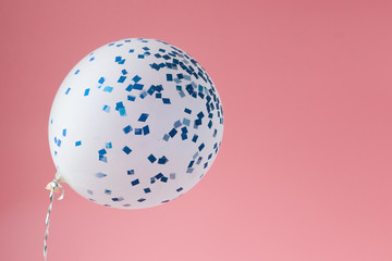 Festive pink background. Shining stars and balloon on light pink pastel background. Christmas. Wedding. Birthday. Happy woman's day. Mothers Day. Valentine's Day. Flat lay, copy space.