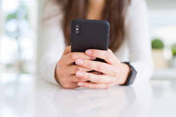 Close up of young woman using smartphone