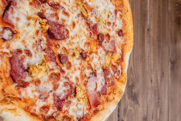 Pizza with Mozzarella cheese, salami, Tomatoes, pepper, Spices. Italian pizza