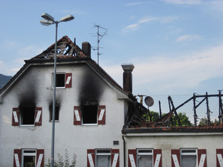 Damaged hotel building after burned by fire, natural disaster. Bad Reichenhall, Germany