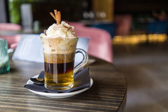 Close up of cup of irish coffee with cream at restaurant