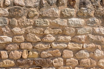antique masonry from the stones of the dilapidated walls of buildings