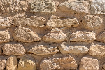 antique masonry from the stones of the dilapidated walls of buildings