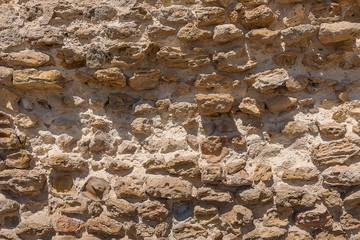 antique masonry from the stones of the dilapidated walls of buildings