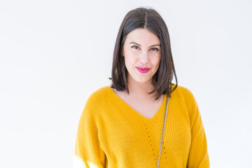 Beautiful brunette young woman smiling confident and cheerful over isolated white background wearing casual yellow sweater