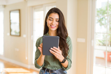 Beautiful young woman working using touchpad tablet