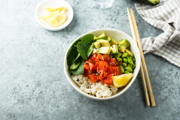 Salmon poke bowl with avocado
