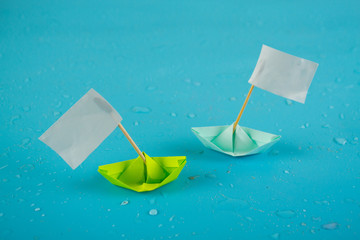 Beated paper ship with with flag