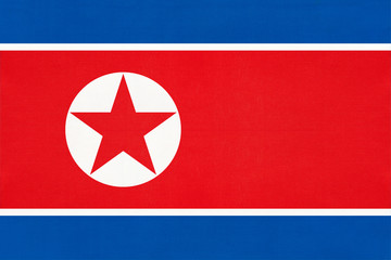 North Korea national fabric flag textile background. Symbol of world asian country.