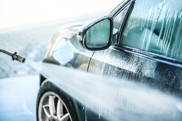 Car wash or cleaning with hight pressured water and using foam. Washing vehicle with brush and...