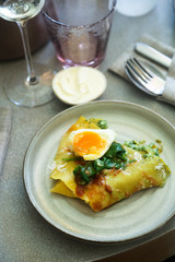Homemade pasta with poached egg and spinach