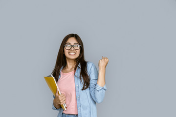 Happy young adult indian woman winner celebrate university admission scholarship good test exam...