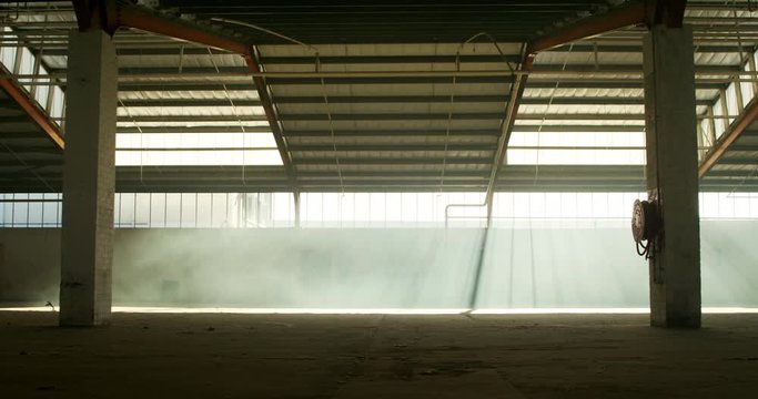 An empty warehouse with smoke grenade