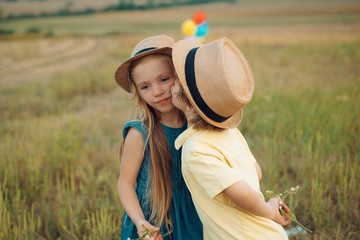 Child playing Happy childhood. Love concept. Romantic and love. Sweet angel children. Kid having fun in spring field. Valentines day card.