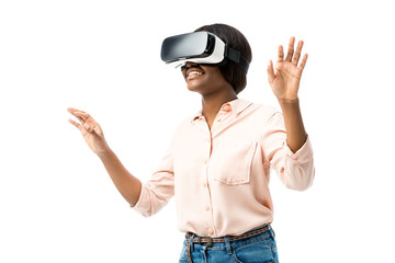 smiling african american woman in shirt with virtual reality headset isolated on white