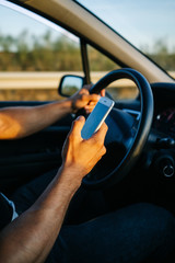 Man using phone while driving