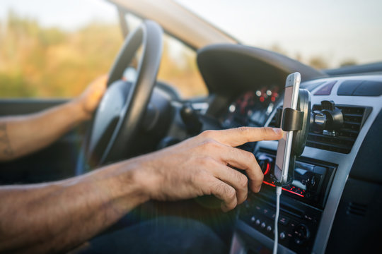 Man Using Phone While Driving