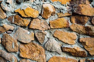 The texture of the old masonry. Background image of a stone-lined wall