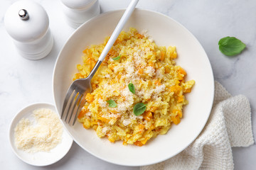 Pumpkin risotto in white bowl