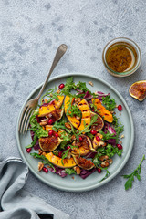 Grilled pumpkin and fig salad on blue plate