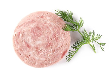 Traditional sausage salami round slice with fresh dill isolated on white background, top view
