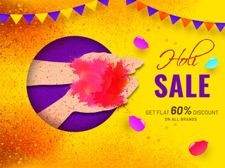 Human hand holding dry color on color splash background for Holi sale poster or banner design.